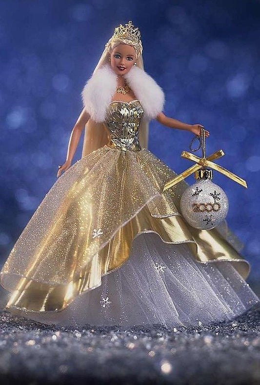 Holiday Barbie 2000 special edition doll dressed in a luxurious gold and white gown with sparkling details.