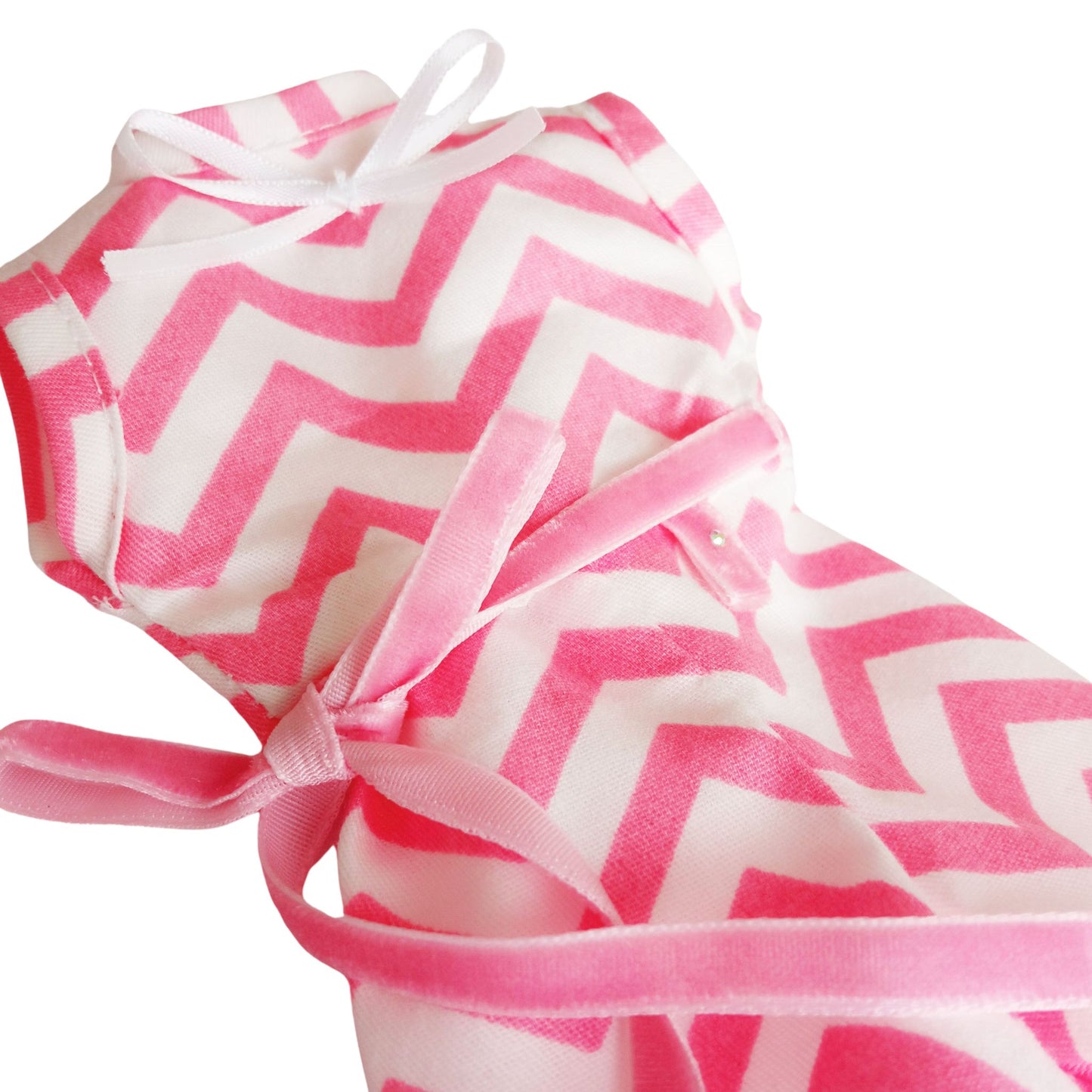 Wearing a pink and white zigzag summer jumpsuit with a ribbon belt and matching headband for doll Paola Reina 32 cm doll.