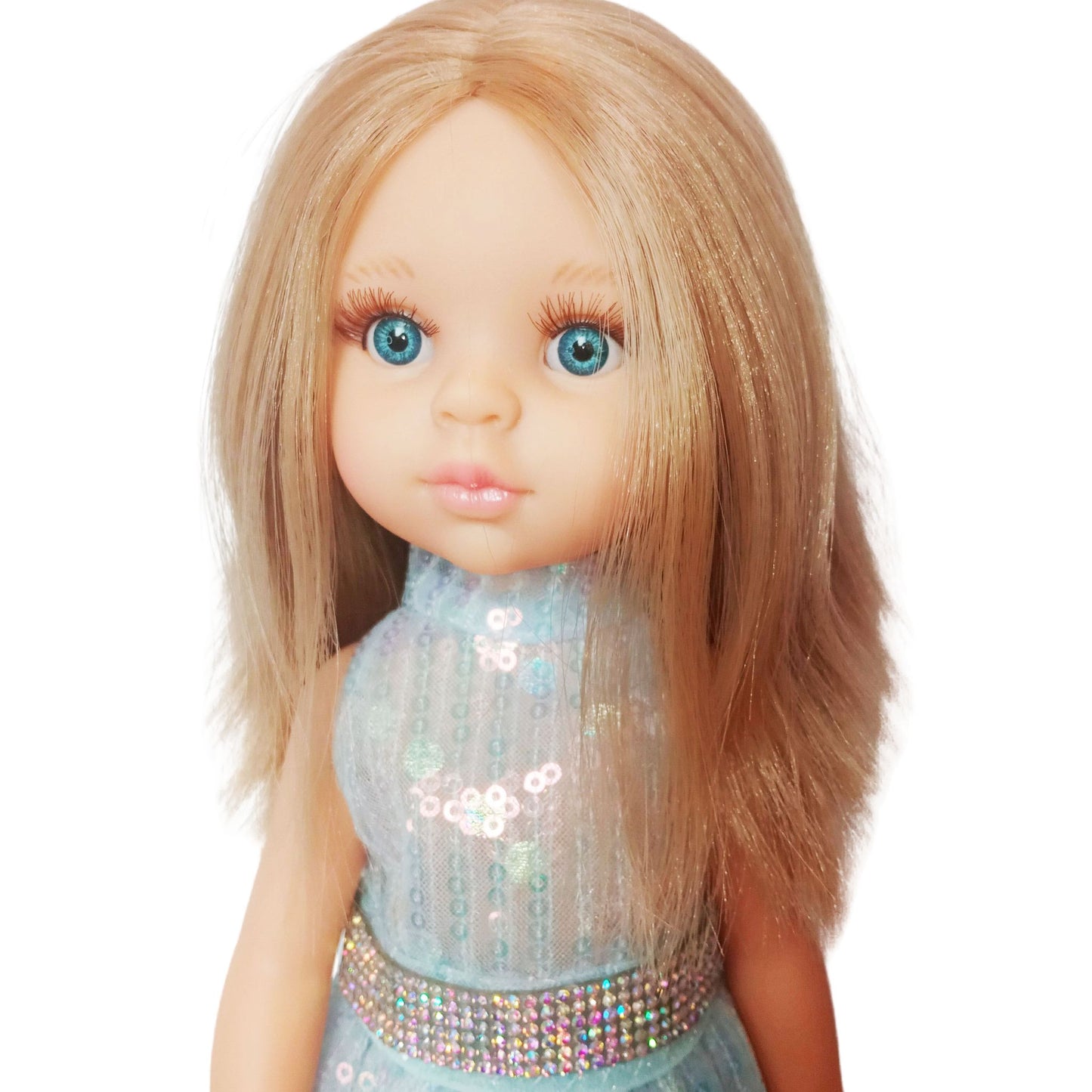 Paola Reina 32 cm doll in a shimmering sequin fairy dress with a sparkling belt and clutch standing on a floor.