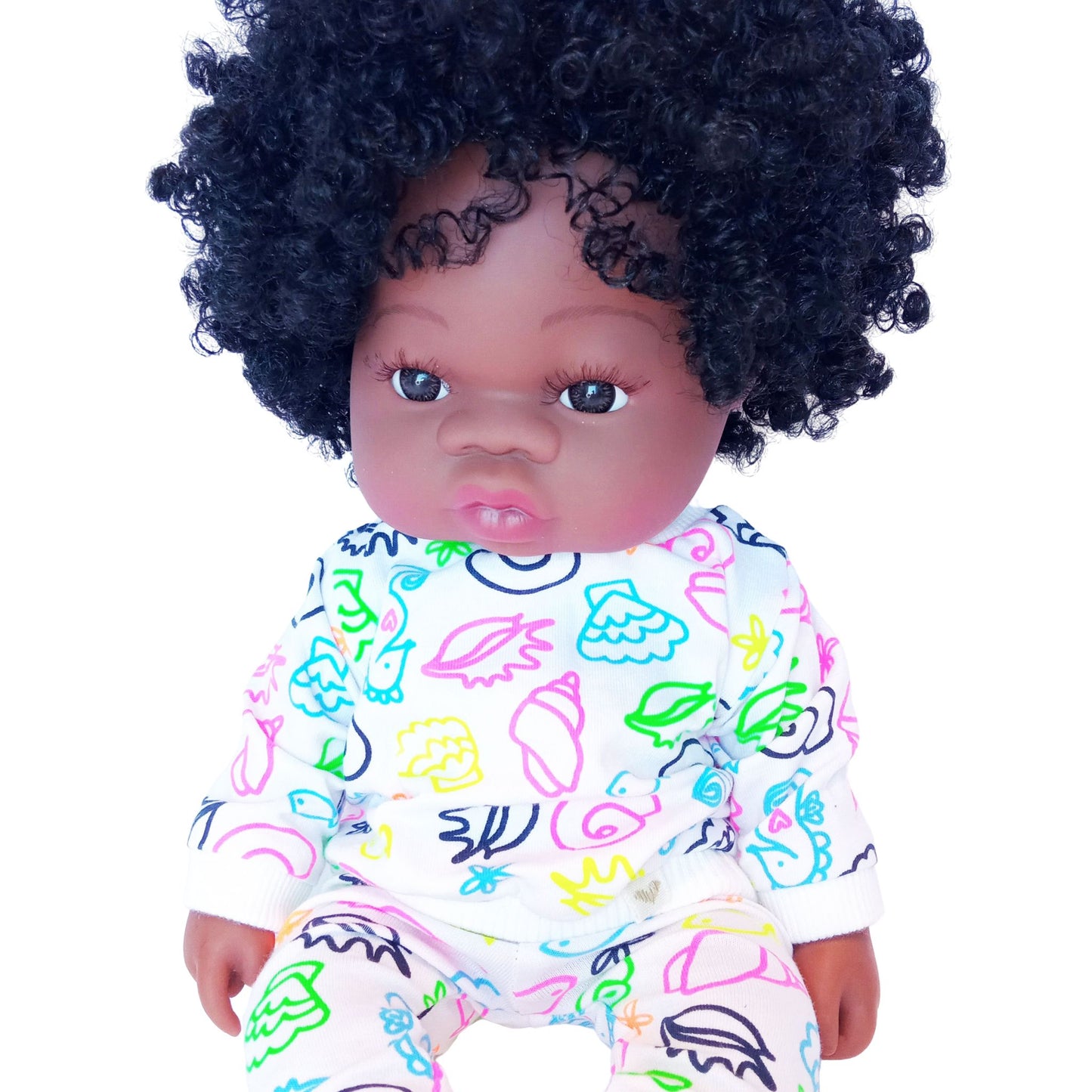 Doll in colorful doodle-print cotton blouse and pants set, sized for 34 cm dolls like Paola Reina and Baby Born.