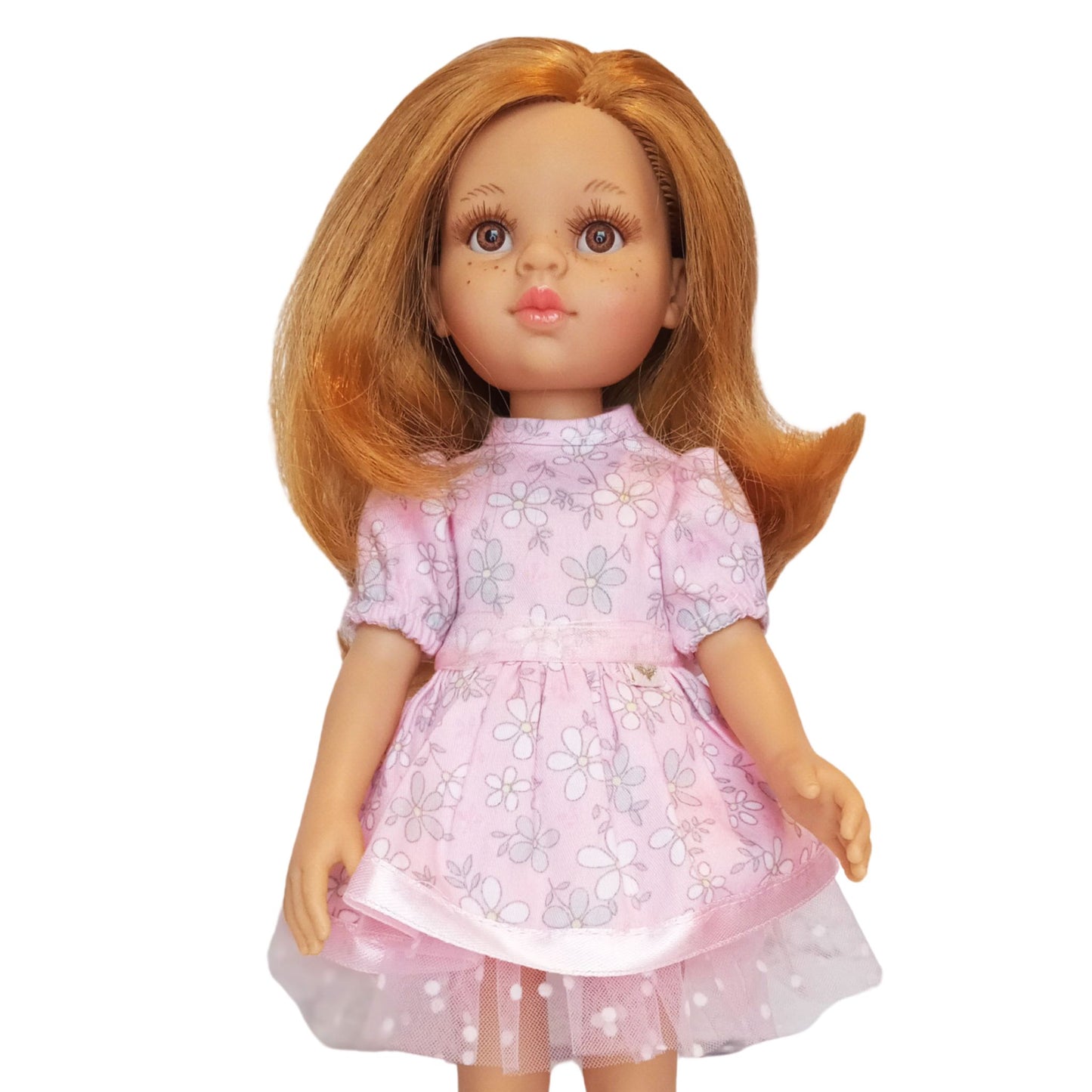 Paola Reina doll wearing pink floral cotton dresses with lace and tulle details.