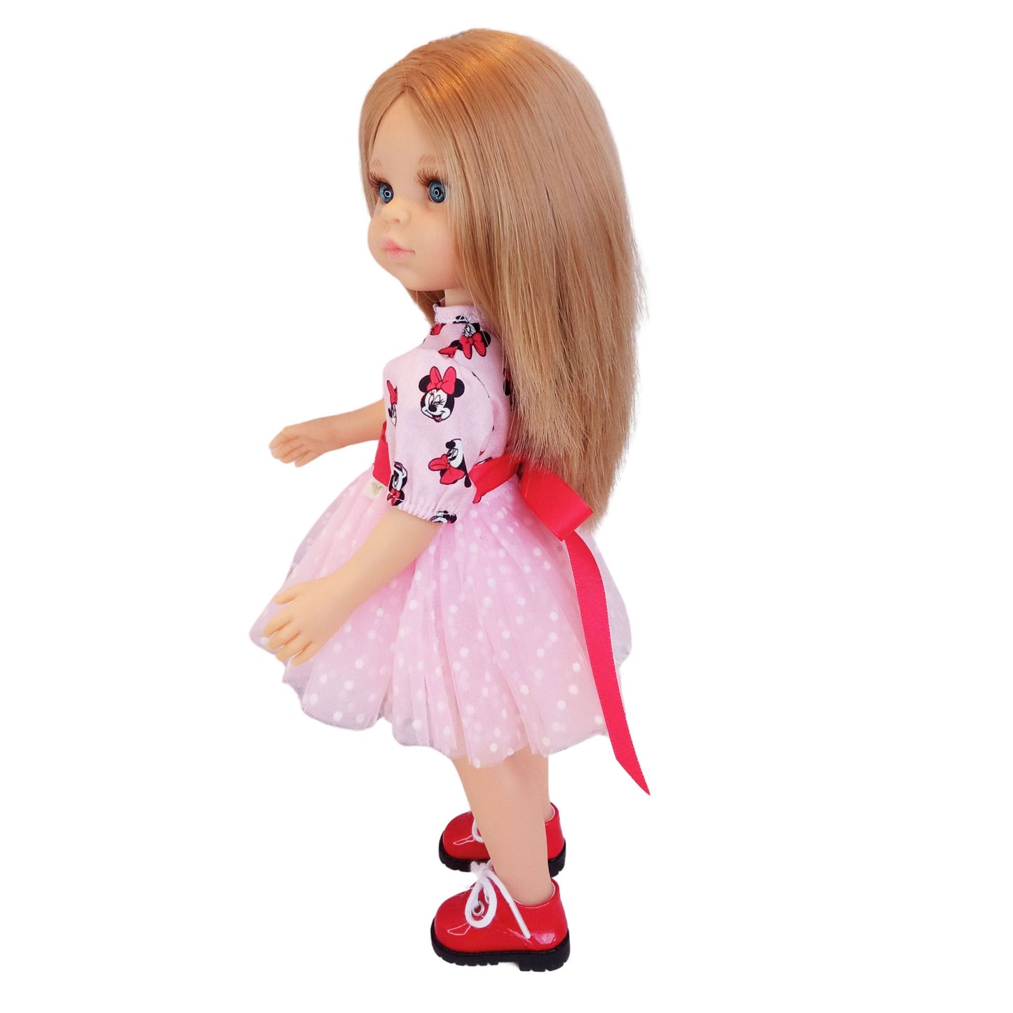 Paola Reina 32 cm doll wearing matching Minnie Mouse-inspired dresses with red satin bows and polka-dot mesh details. One doll has red shoes.