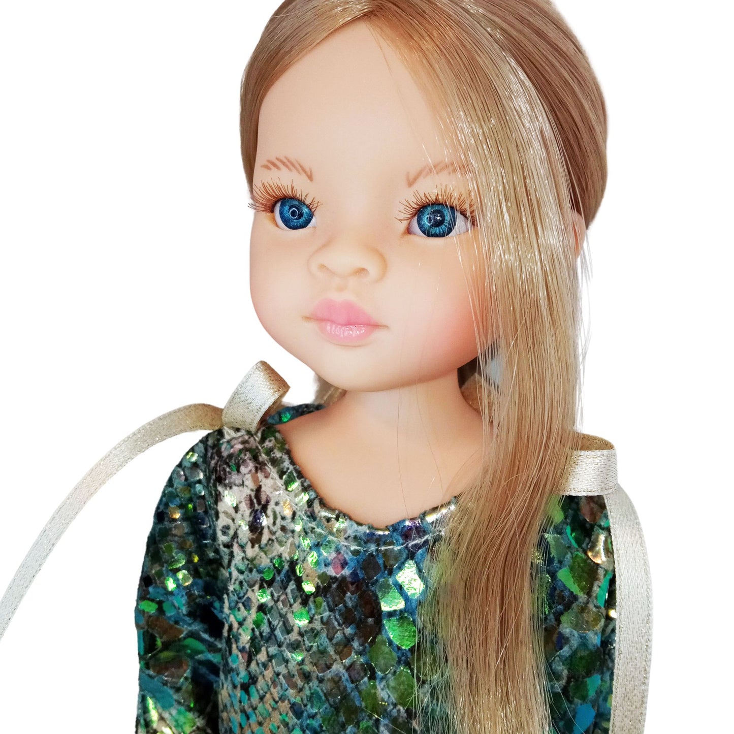 A shimmering green and gold sequined dress for a 12-inch/32 cm Paola Reina doll, featuring gold ribbon ties and a luxurious party-ready design.