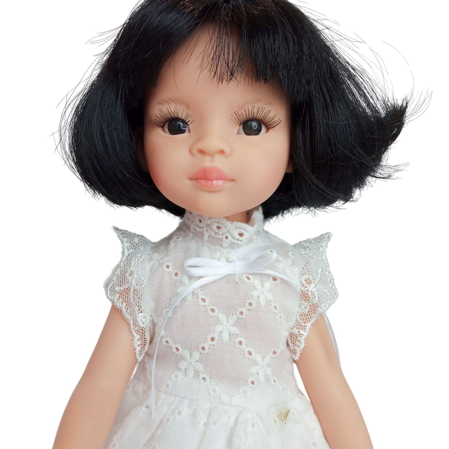 Handmade white lace dress for dolls 32 cm with short black hair, featuring intricate lace details.