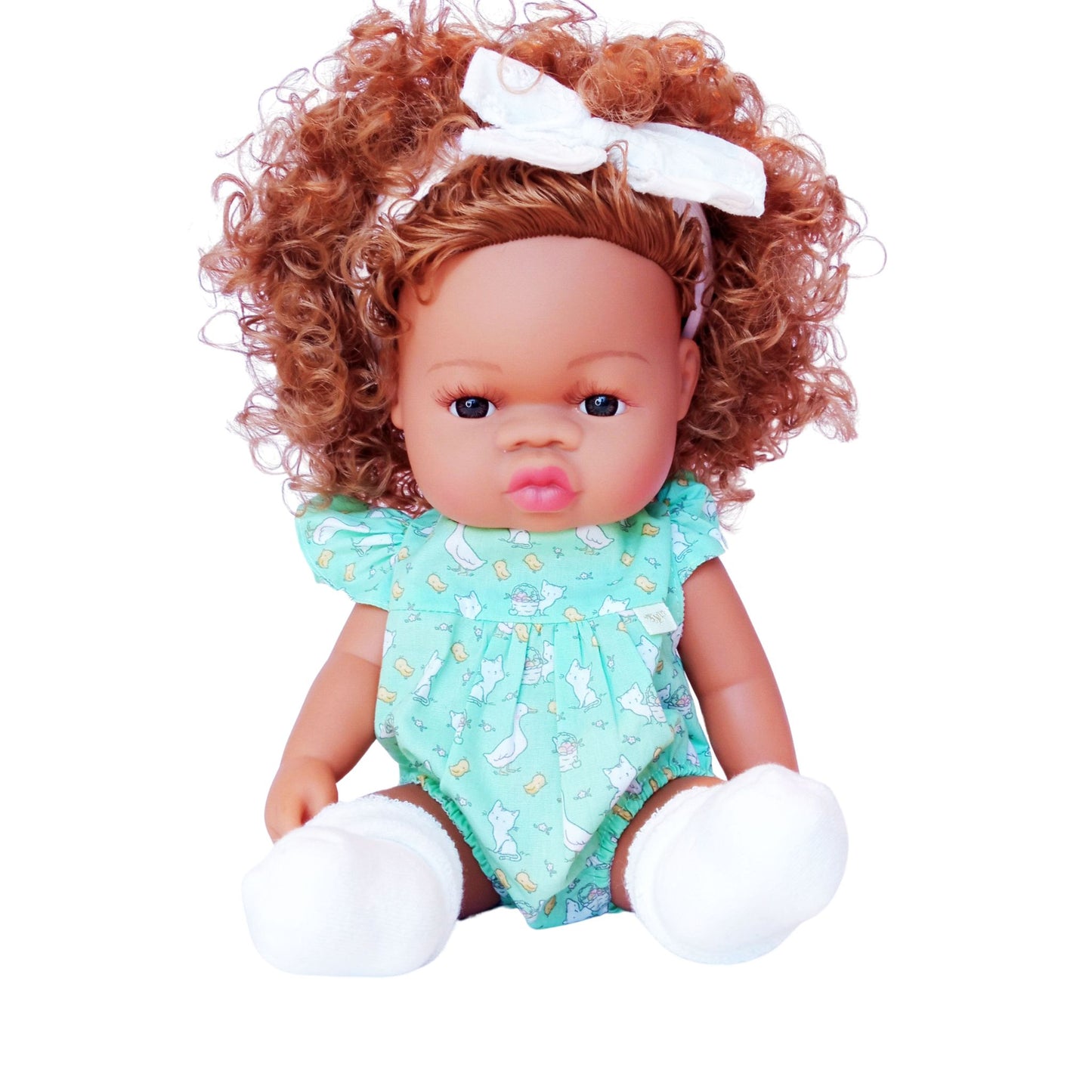 Curly-haired doll wearing a mint green bodysuit with playful prints, white socks, and a white headband – perfect fit for 34 cm Paola Reina or Baby Born dolls.