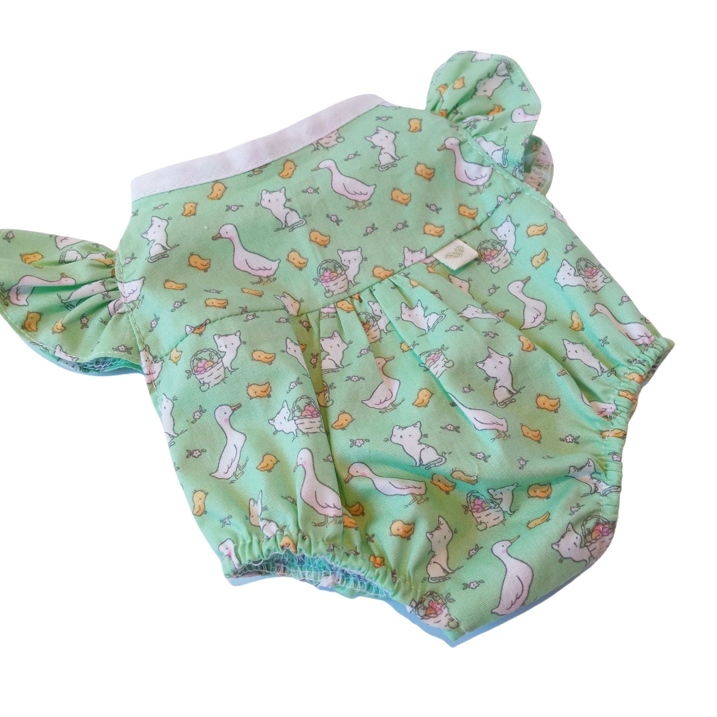 A mint green bodysuit with playful prints, perfect fit for 34 cm Paola Reina or Baby Born dolls.