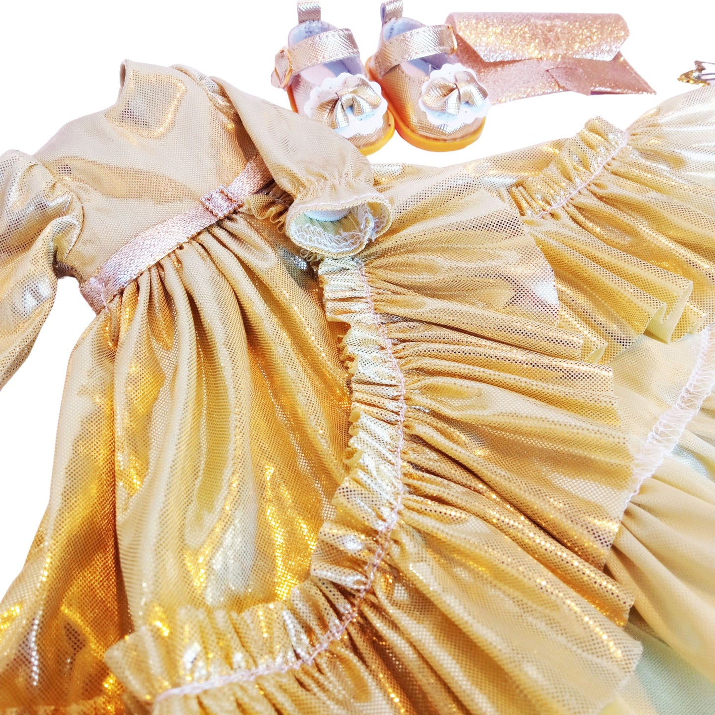Dressed in an elegant shimmering gold gown with ruffles, holding a glittery clutch, and wearing stylish gold-trimmed shoes for Paola Reina 32 cm doll.
