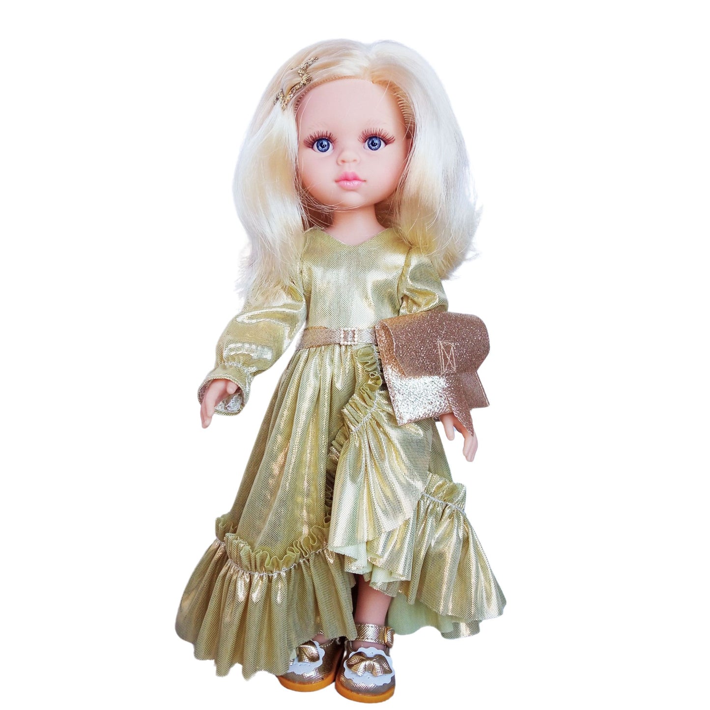 Paola Reina 32 cm doll Claudia dressed in an elegant shimmering gold gown with ruffles, holding a glittery clutch, and wearing stylish gold-trimmed shoes.