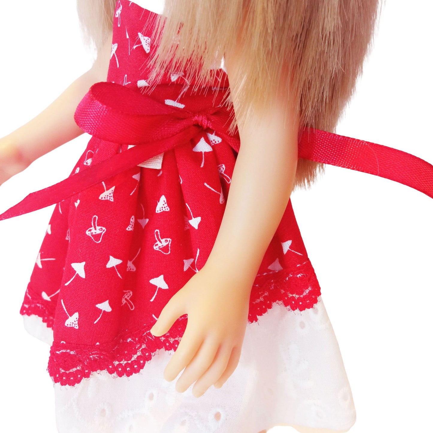 Red and white doll dress with a lace bodice, fly agaric mushroom print, and a satin bow, paired with red lace-up boots, designed for a 32 cm Paola Reina doll.