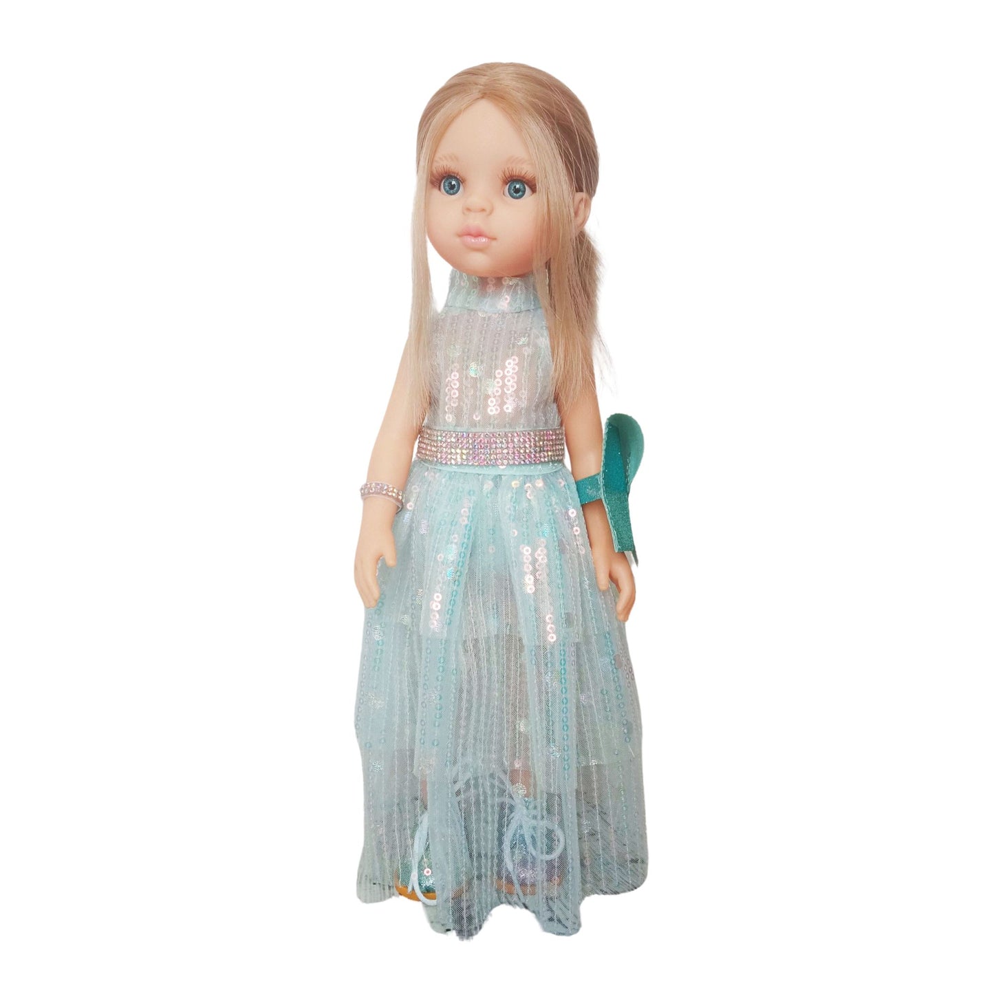 Paola Reina 32 cm doll in a shimmering sequin fairy dress with a sparkling belt, glitter shoes and clutch, standing on a floor.
