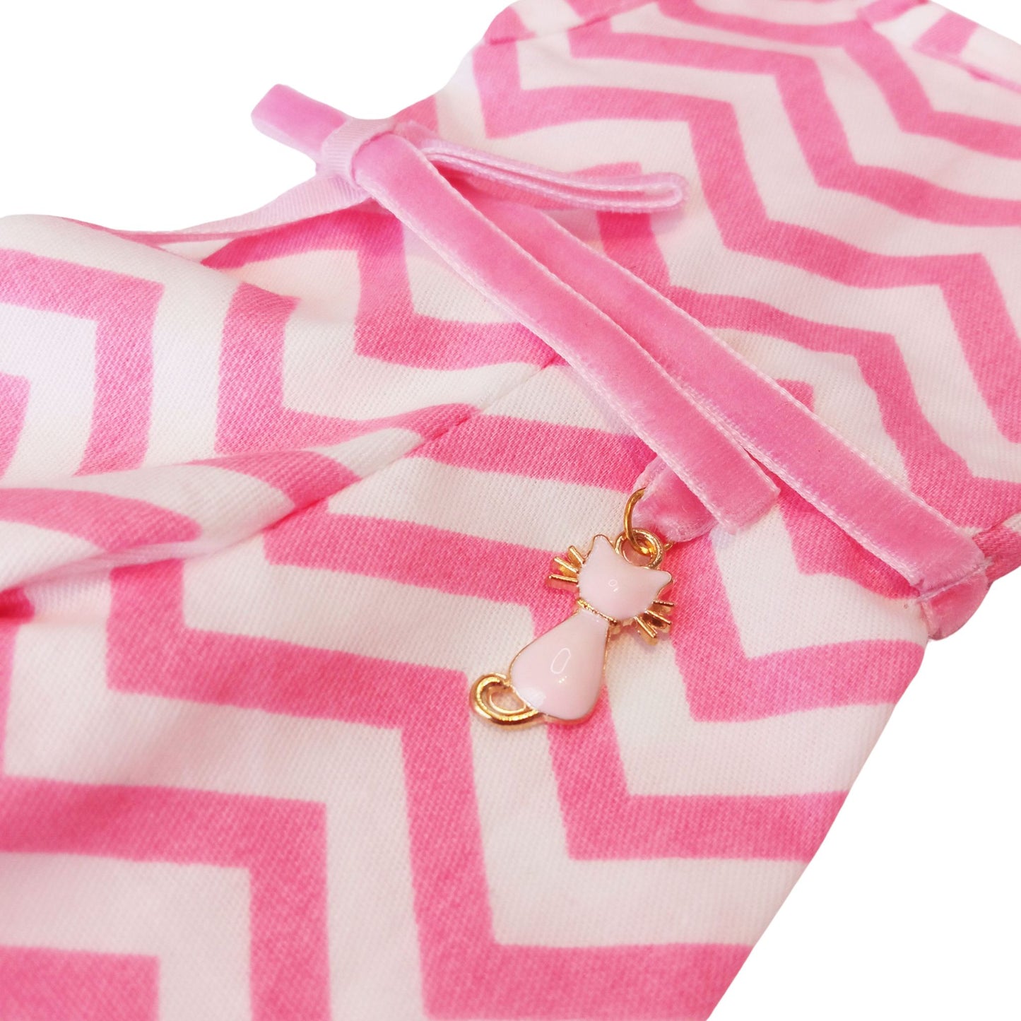 Wearing a pink and white zigzag summer jumpsuit with a ribbon belt and matching headband for doll Paola Reina 32 cm doll.