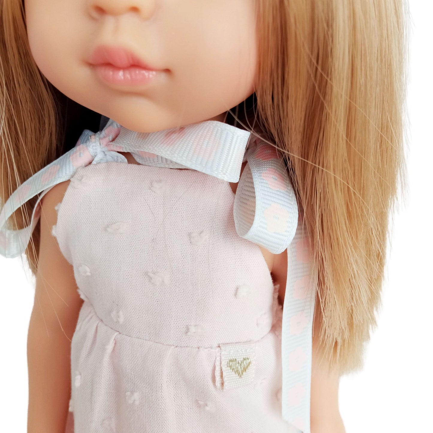 Soft pink sleeveless dress with lace trim perfect for playful adventures and tea parties.