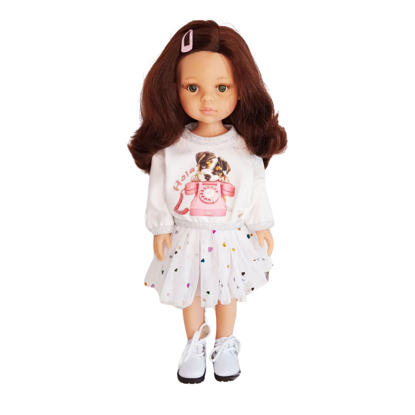 Paola Reina doll dressed in a white blouse with a puppy print and a mesh skirt decorated with colorful hearts.