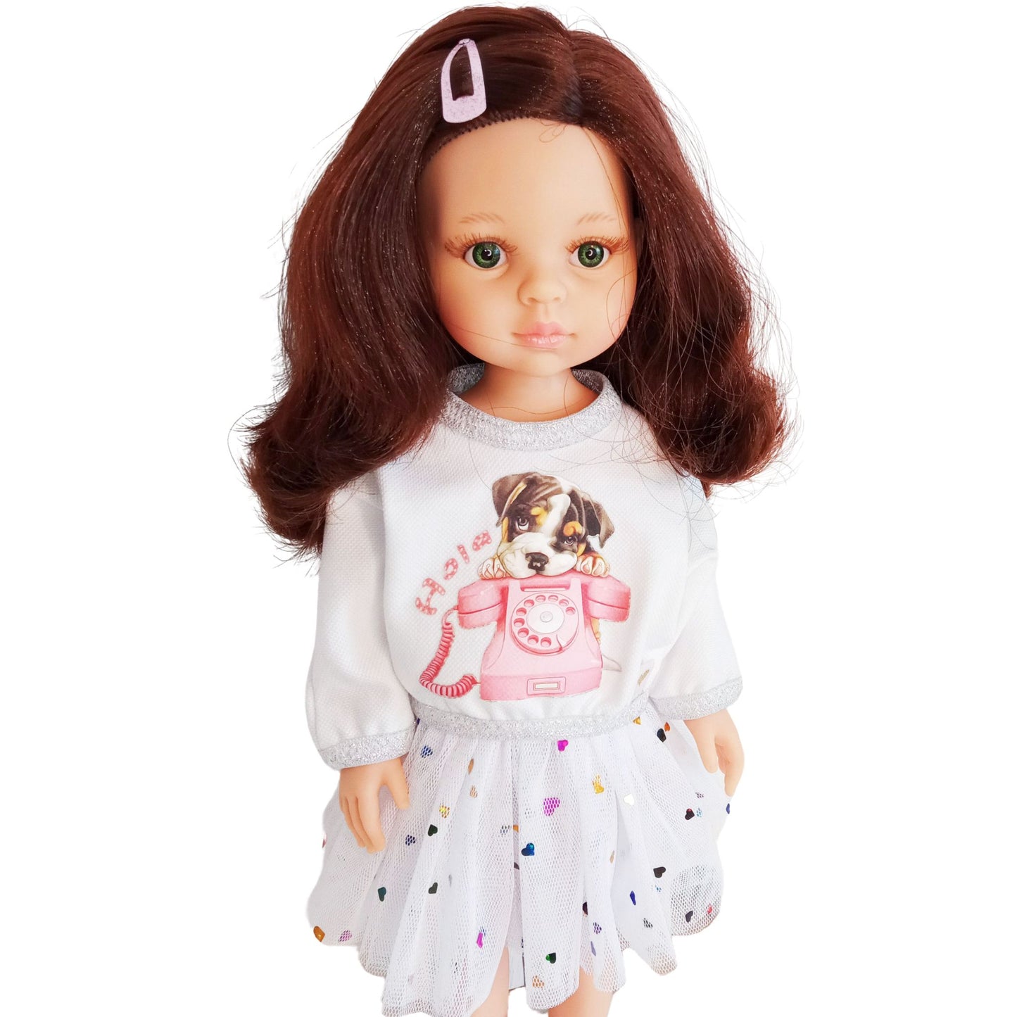 Paola Reina doll dressed in a white blouse with a puppy print and a mesh skirt decorated with colorful hearts.