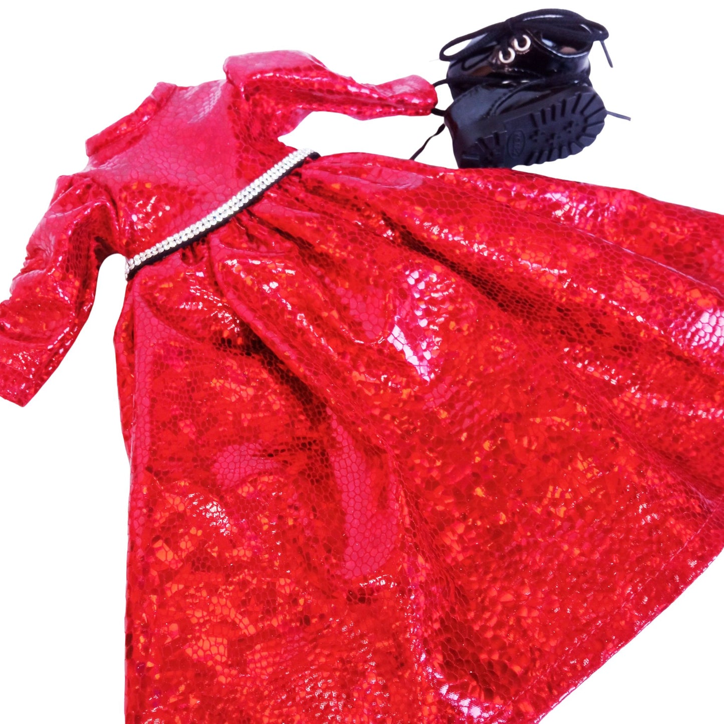A red sparkling dress with a rhinestone belt and black patent leather shoes, standing against a white background for Paola Reina 32 cm doll.