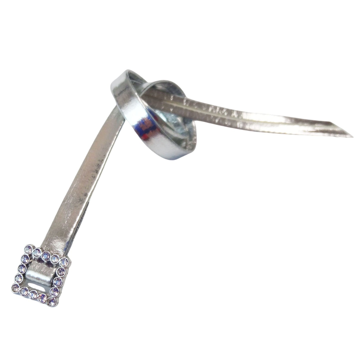 A silver doll belt with a sparkling rhinestone buckle, designed for Paola Reina 32 cm (12-inch) dolls, stylishly coiled in a playful knot.