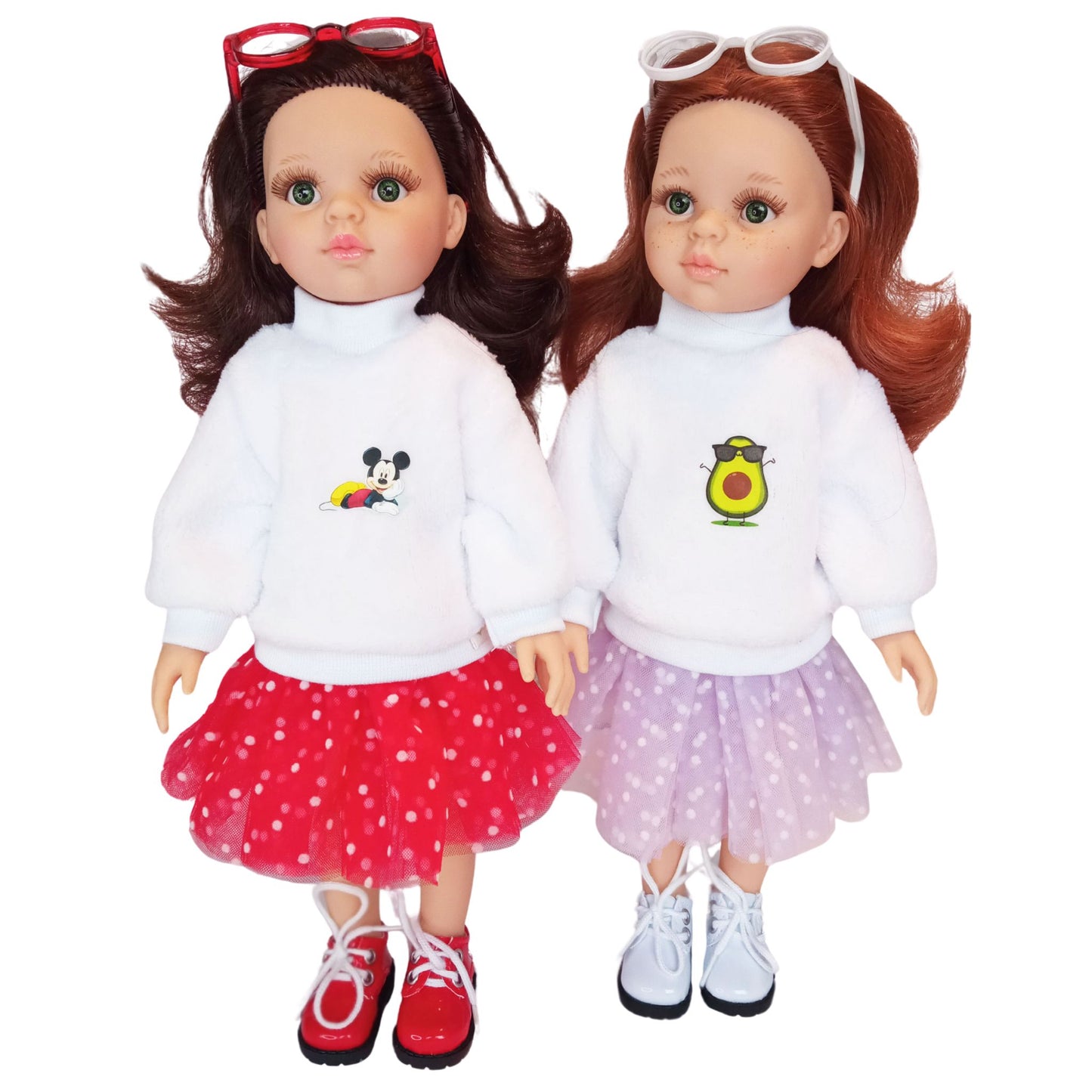 Two stylish Paola Reina dolls dressed in white plush sweatshirts with cute embroidery and fluffy polka-dot mesh skirts.