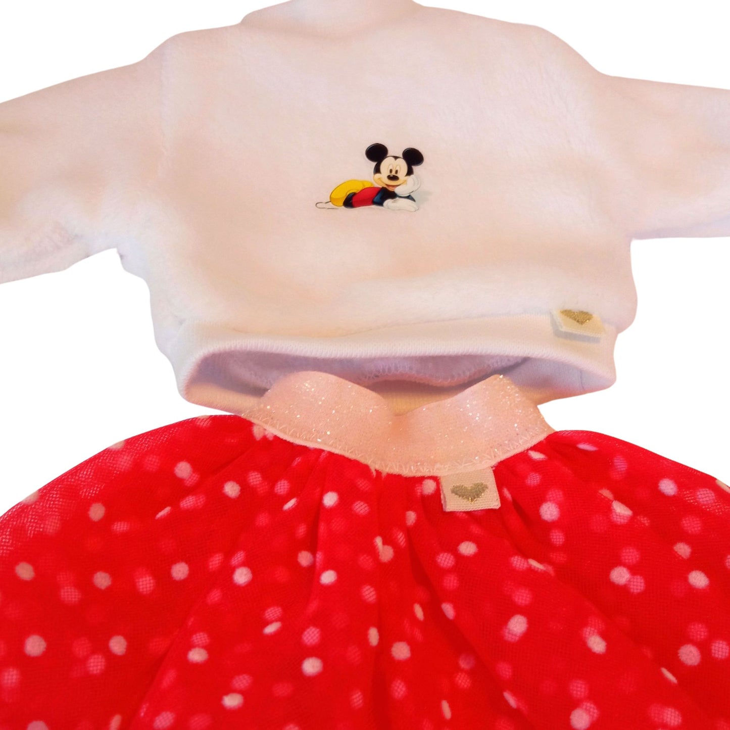 Stylish Paola Reina dolls dressed in white plush sweatshirts with cute embroidery and fluffy polka-dot mesh skirts.
