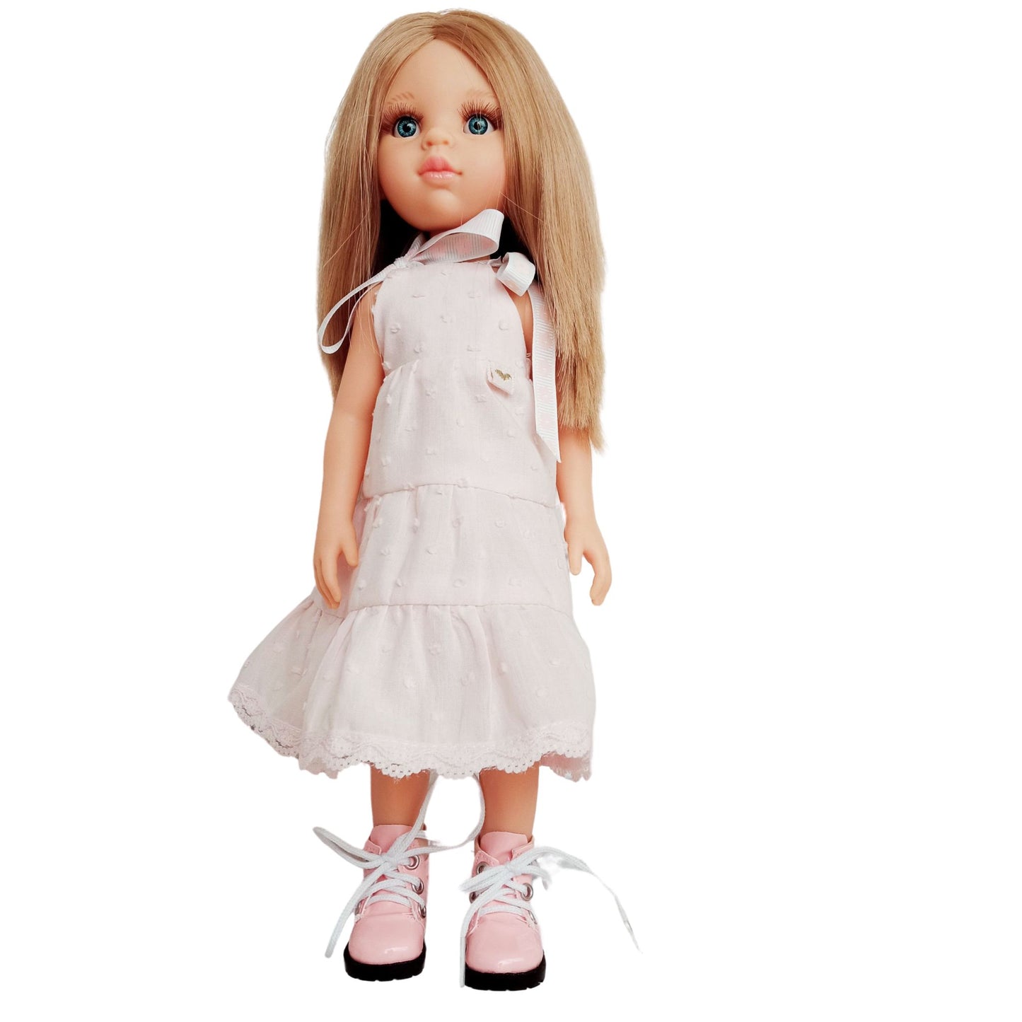Blonde doll wearing a soft pink sleeveless dress with lace trim and matching pink boots, perfect for playful adventures and tea parties.