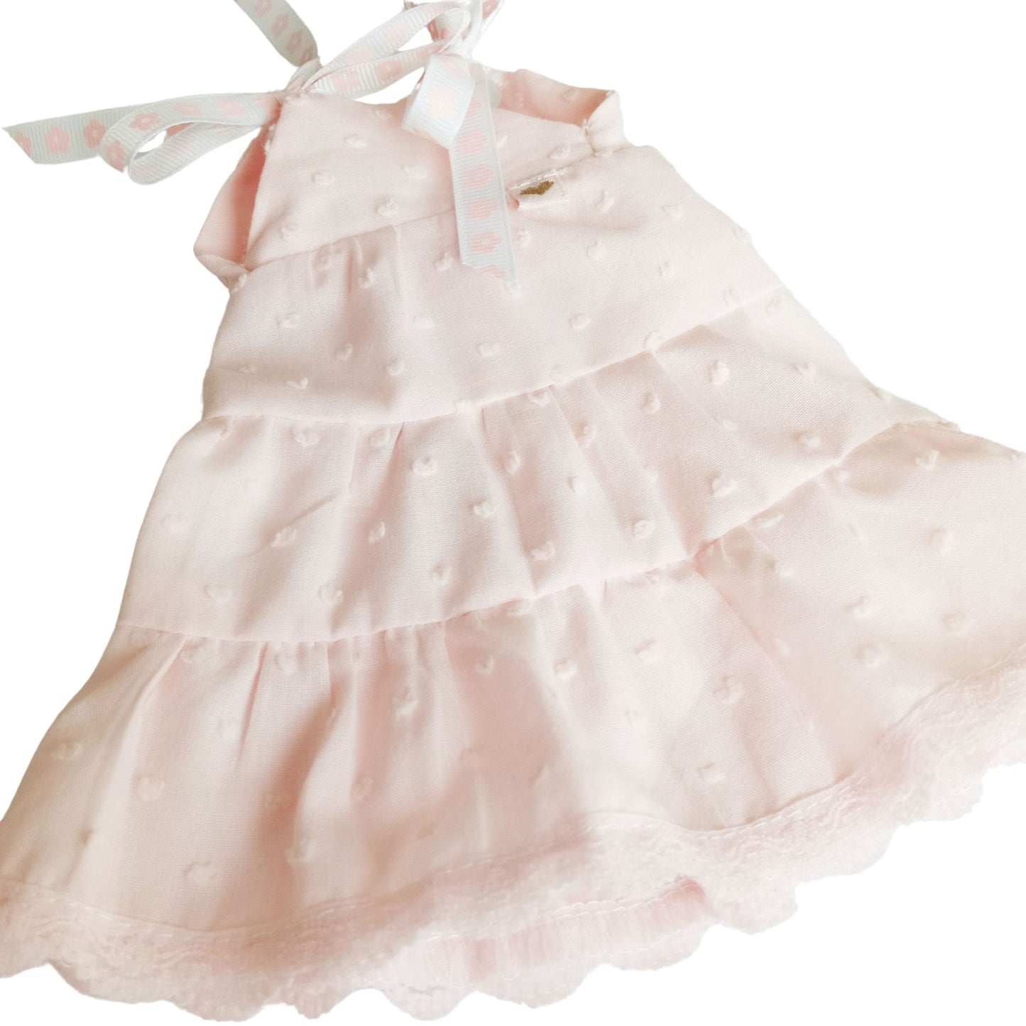 Soft pink sleeveless dress with lace trim perfect for playful adventures and tea parties.