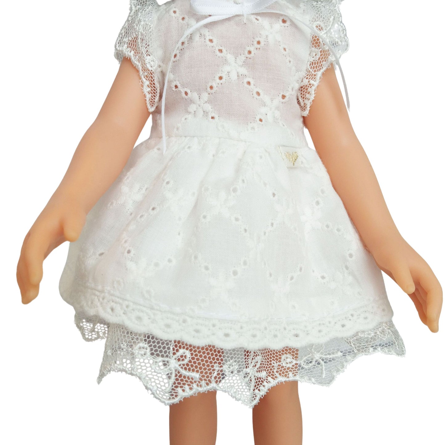 Handmade white lace dress for dolls with short black hair, featuring intricate lace details.