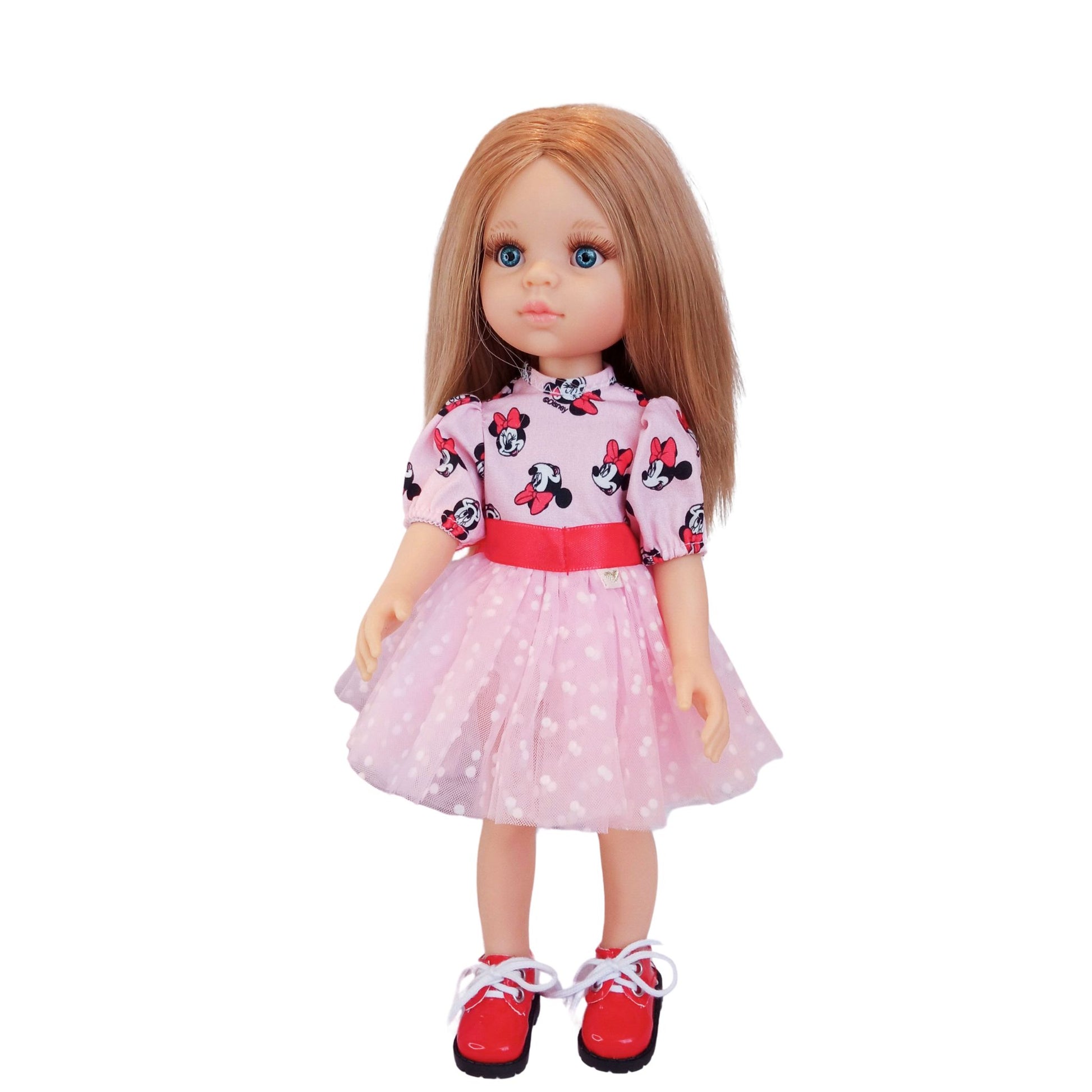 Paola Reina 32 cm doll wearing matching Minnie Mouse-inspired dresses with red satin bows and polka-dot mesh details. One doll has red shoes.