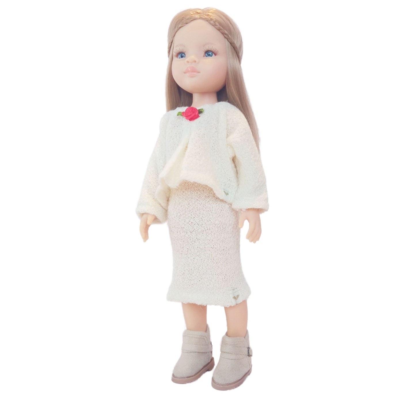 Paola Reina Las Amigas 32 cm dollswearing handmade knitted jersey outfits with floral accents.