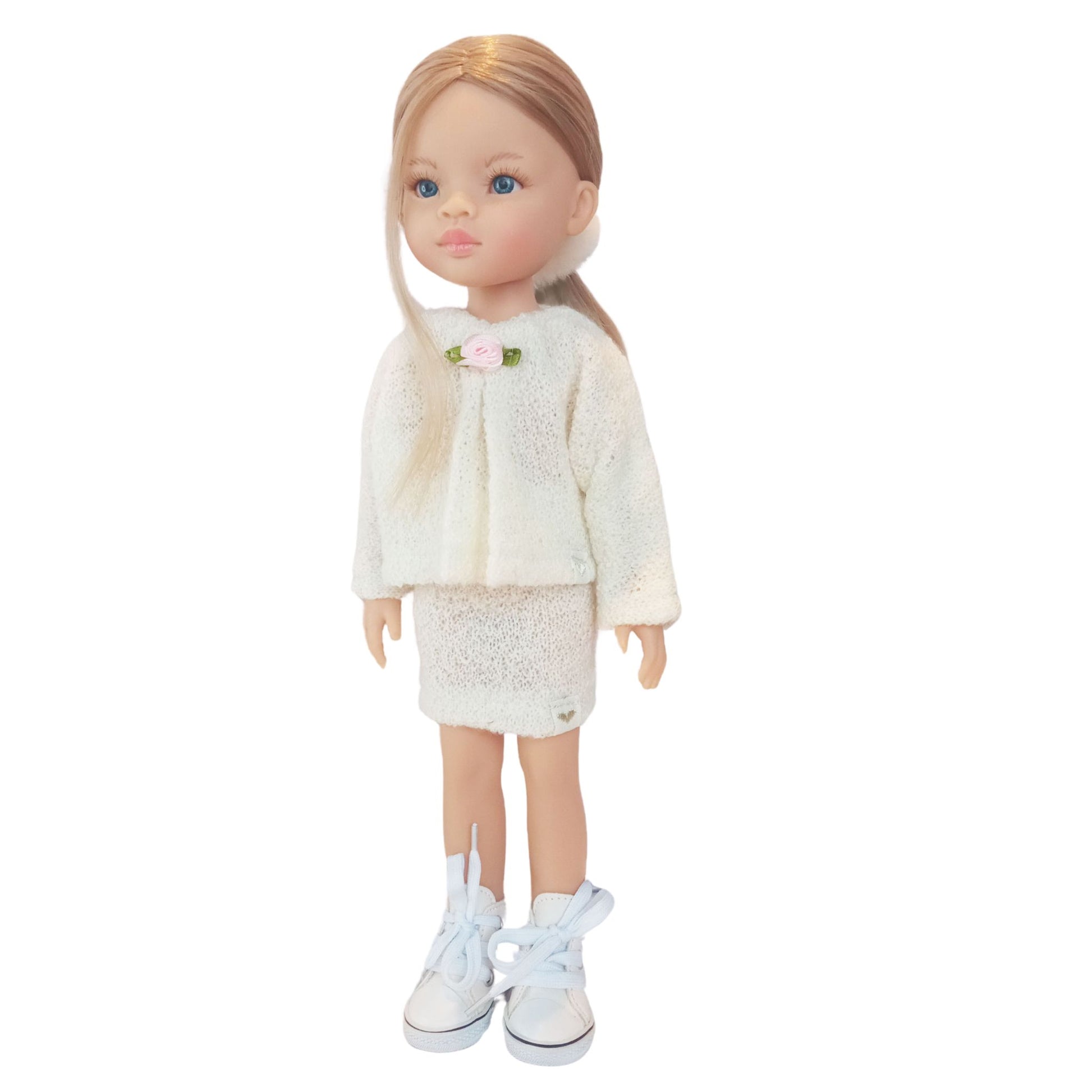 Paola Reina Las Amigas 32 cm dollswearing handmade knitted jersey outfits with floral accents.