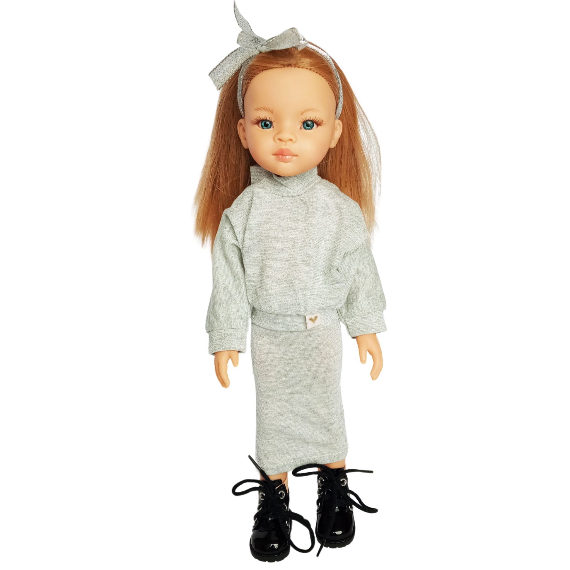 Paola Reina doll wearing stylish shimmer jersey sets with a skirt,  paired with black sneakers and cute accessories.