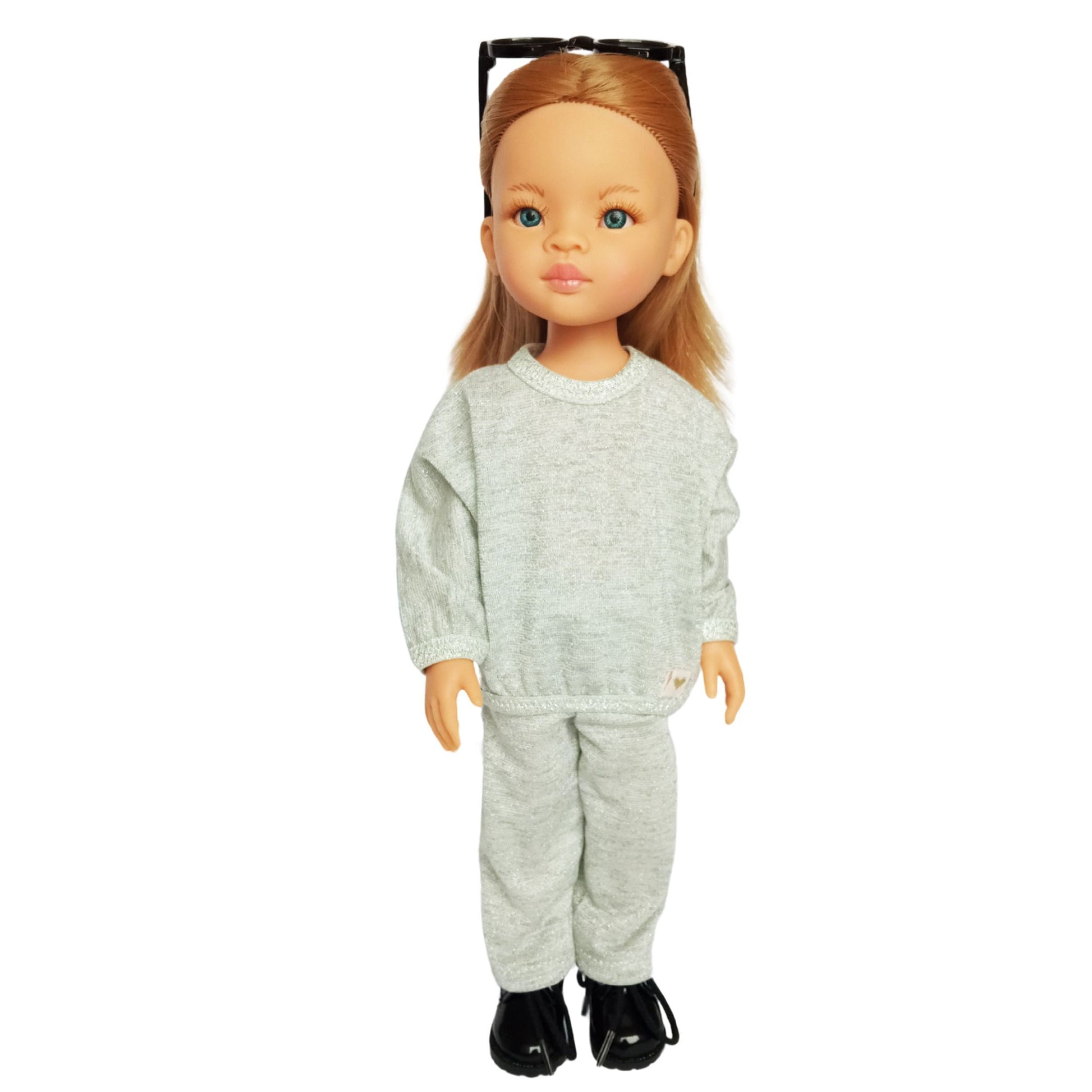 Paola Reina doll wearing stylish shimmer jersey sets with pants – paired with black sneakers and cute accessories.