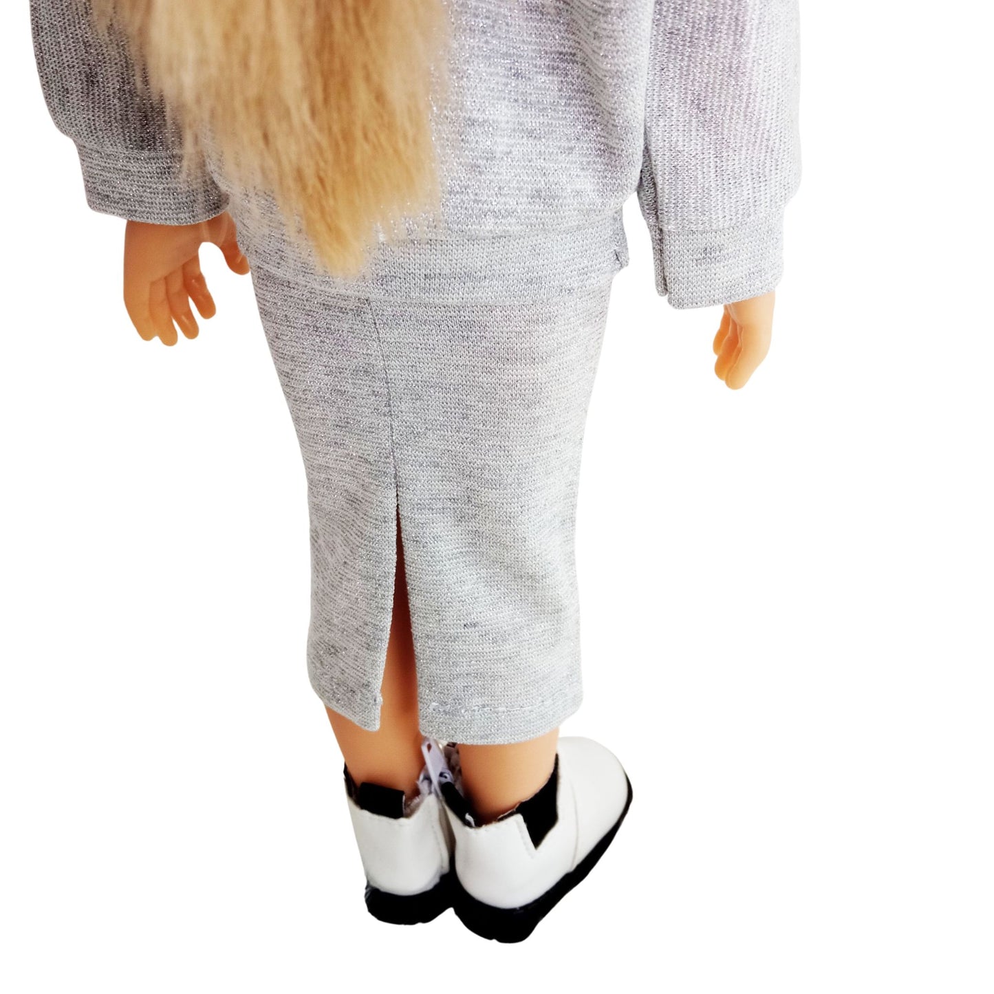 Paola Reina doll wearing stylish shimmer jersey sets with a skirt,  paired with black sneakers and cute accessories.