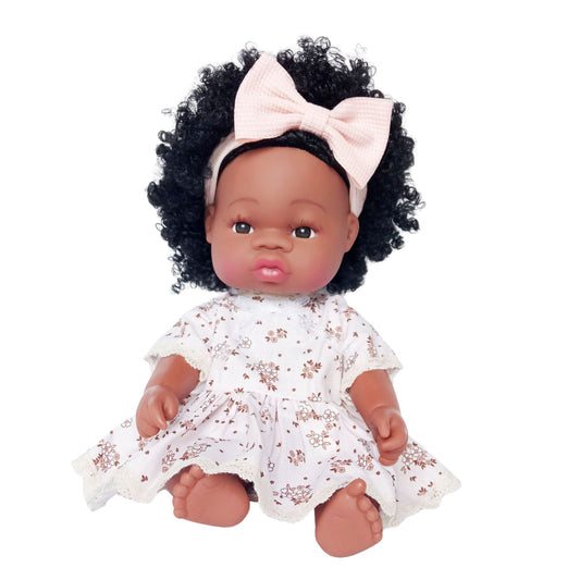 Curly-haired doll wearing a vintage-style cotton dress with brown floral print and lace edging, fits 34 cm (13 inch) Paola Reina, Baby Born, and similar dolls.