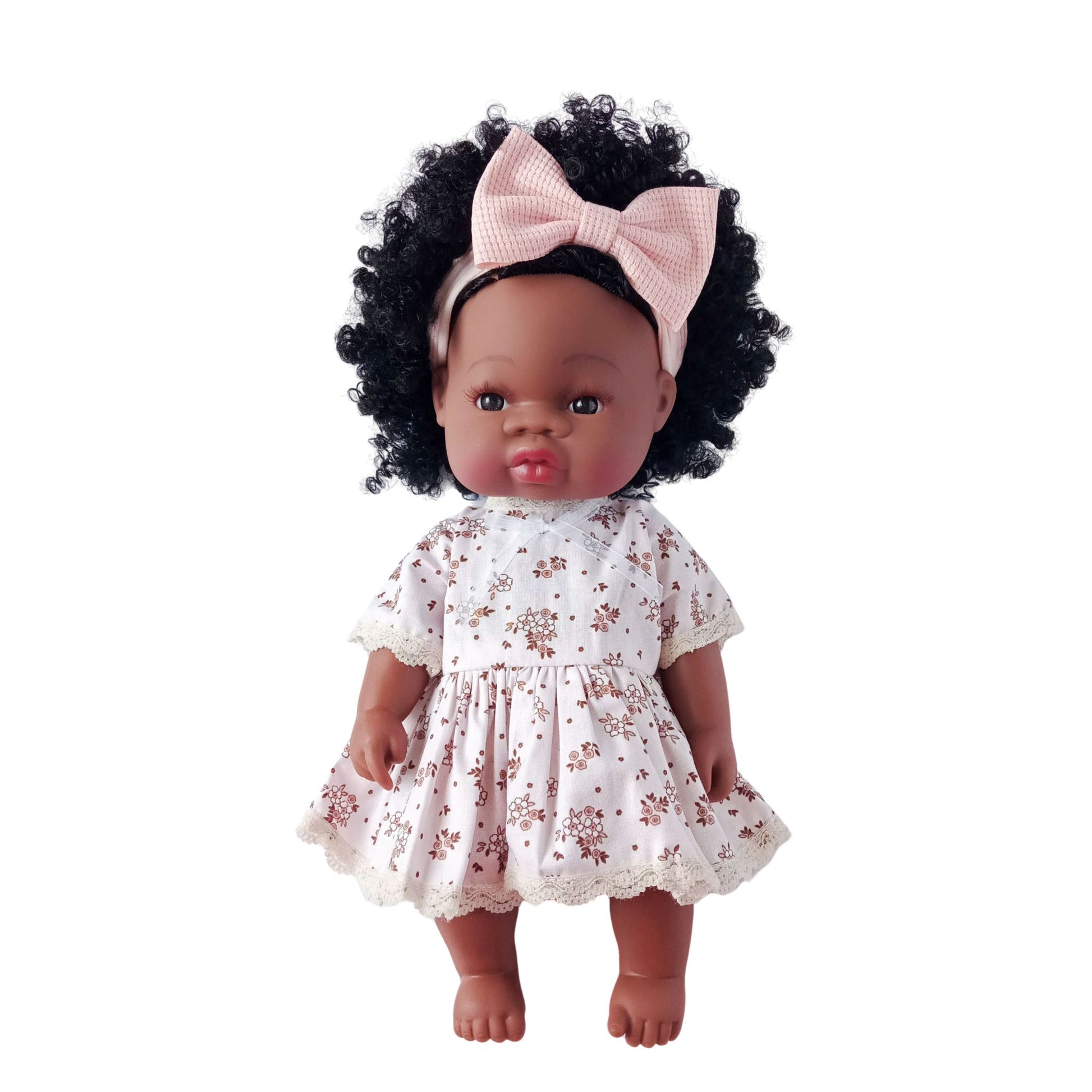 Curly-haired doll wearing a vintage-style cotton dress with brown floral print and lace edging, fits 34 cm (13 inch) Paola Reina, Baby Born, and similar dolls.