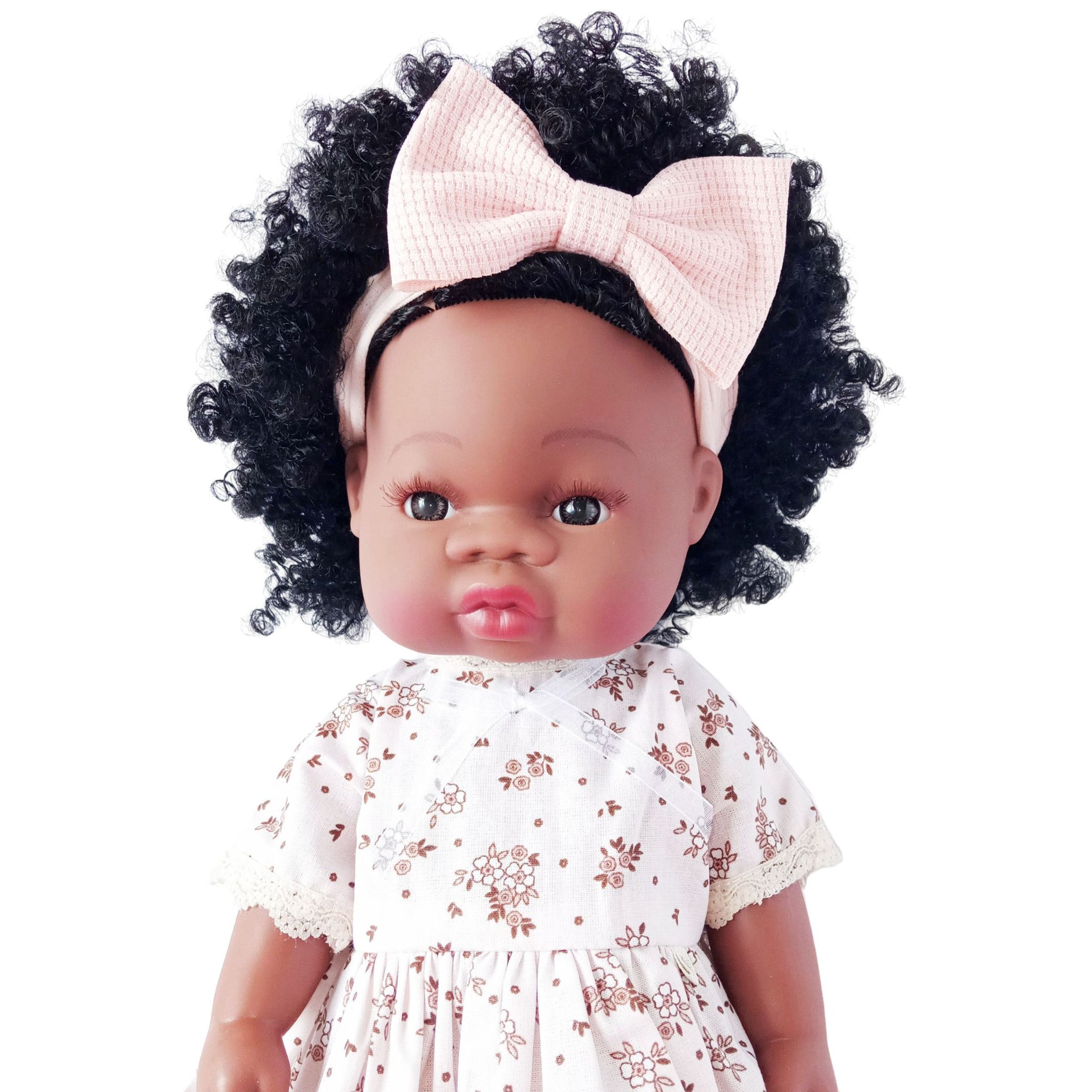 Curly-haired doll wearing a vintage-style cotton dress with brown floral print and lace edging, fits 34 cm (13 inch) Paola Reina, Baby Born, and similar dolls.